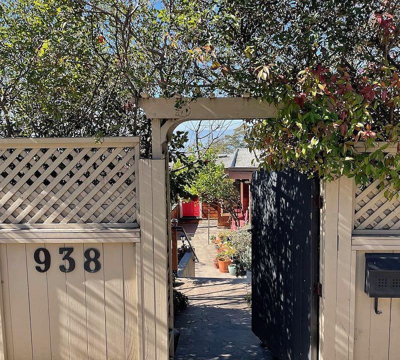 Welcome to our home! Steps down into sunny, private front yard.