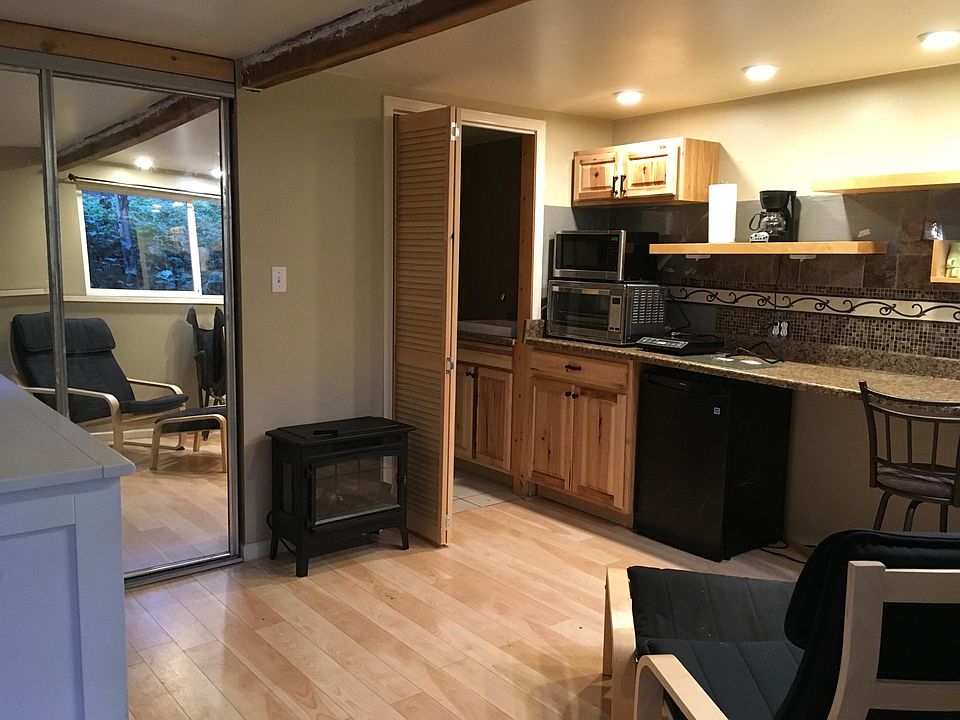 Main Room of Studio - shows Kitchenette with Burner, oven, microwave, refrigerator. Bathroom has a deep sink with a removeable sprayer to use for washing dishes..