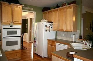 Warm, inviting kitchen with breakfast bar open to great room!