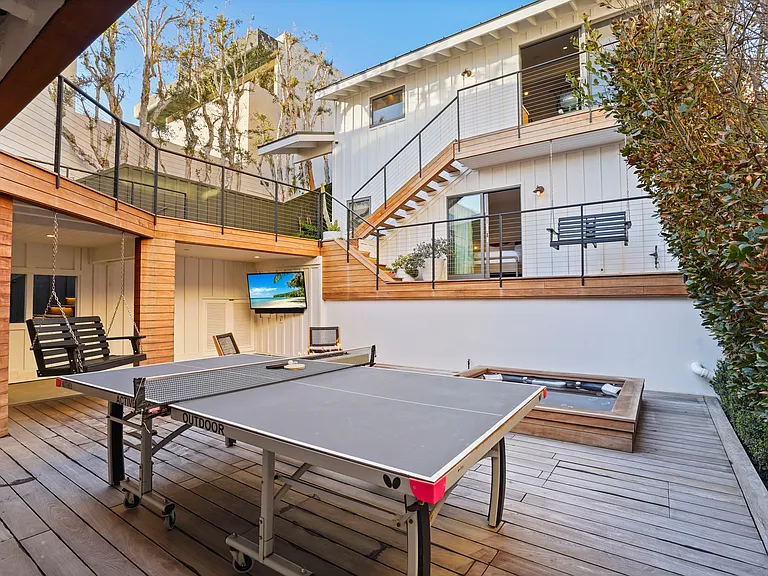 An outdoor retreat designed for fun_ping pong, a firepit, and endless ways to relax.