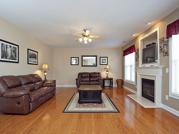 Stunning family room has gas log fireplace