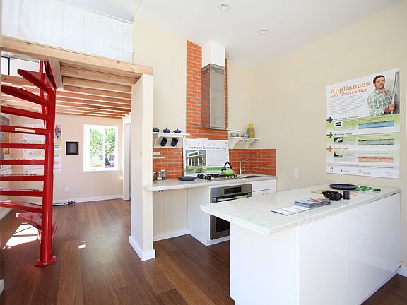Open kitchen area with little breakfast bar