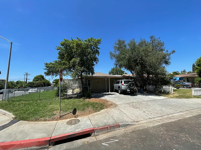 Side of house and car port.