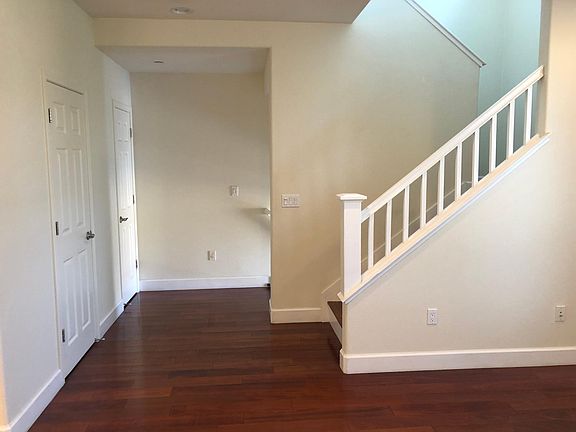Living Room with Powder Bath and Stair to 3rd Floor