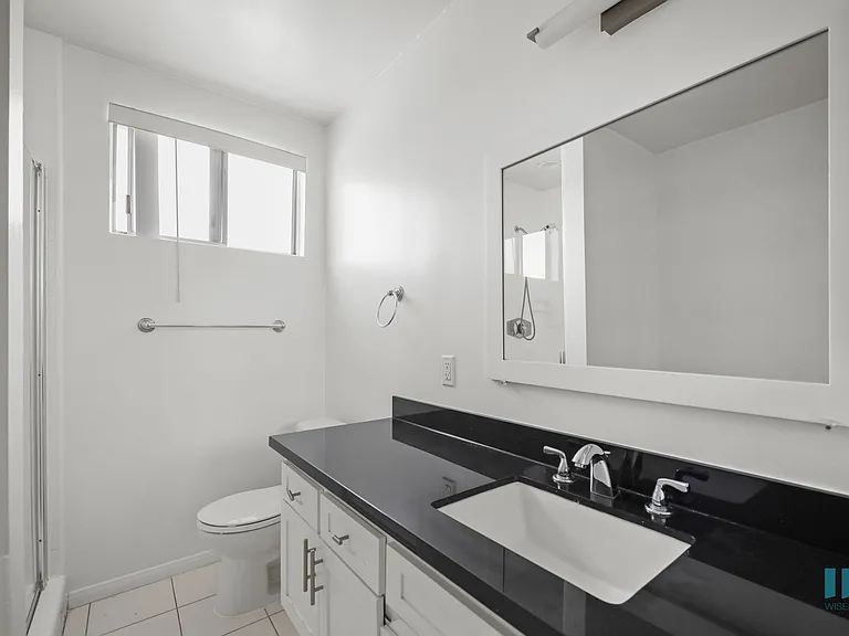 Bathroom with Stand-Up Shower and Vanity Cabinet Storage