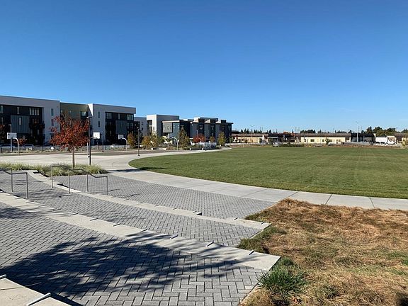 Four-acre park with sport courts, trails. basketball courts and play structure in the neighborhood