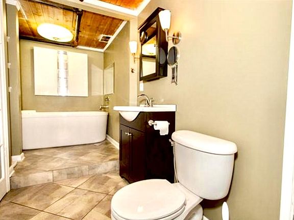 Master bath with standing showing and separate garden/soakin