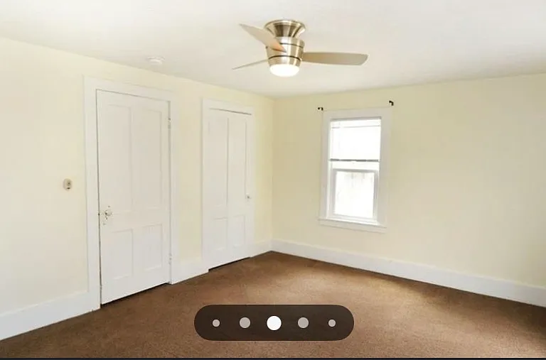 1st bedroom showing entrance and closet doors