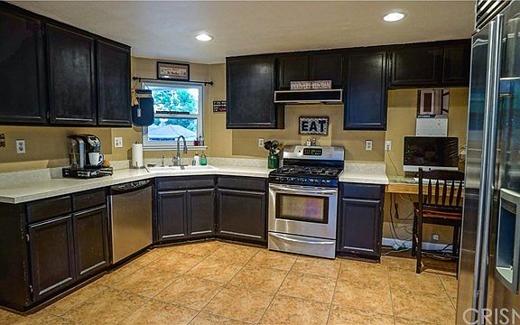 Nice sized kitchen off living room with slider to rear patio