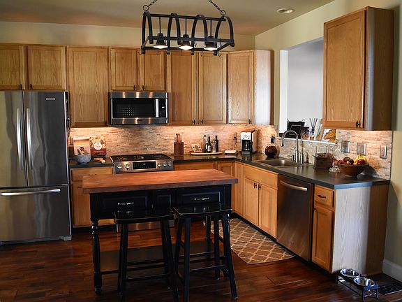 Large open floor plan kitchen featuring stainless appliances