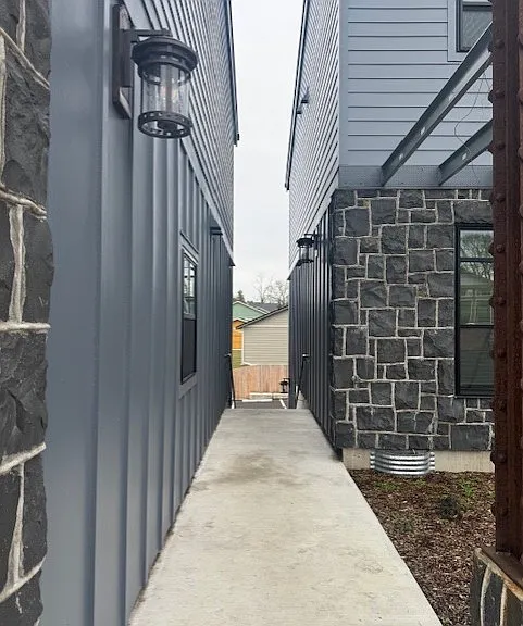another view going to stair to parking and trash area