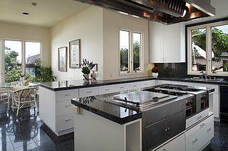 Island kitchen with stainless appliances and granite counter tops