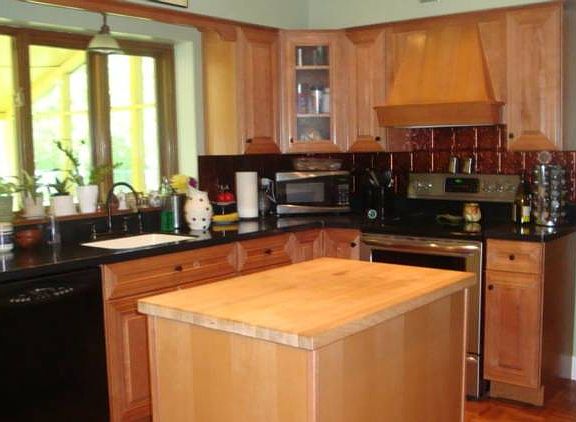 Updated kitchen a few years ago. Features newer appliances and corian countertops.