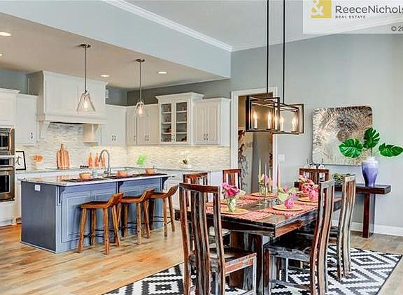 Spacious kitchen boasts generous amount of cabinets, counter space and a wonderful island.