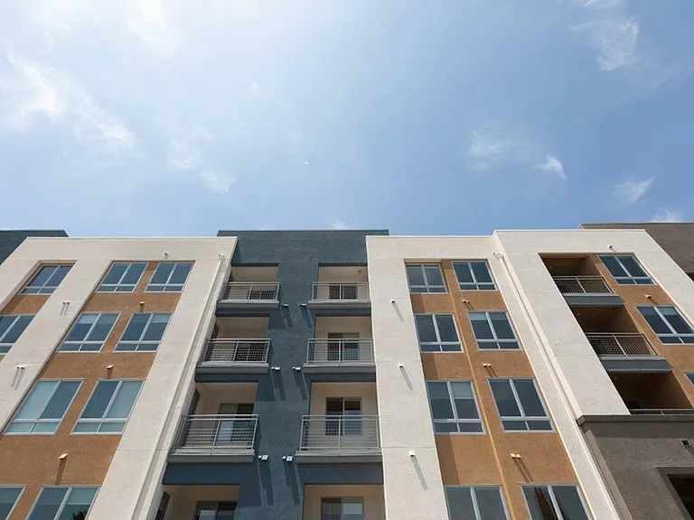 Spacious grounds surrounding the apartment exteriors.