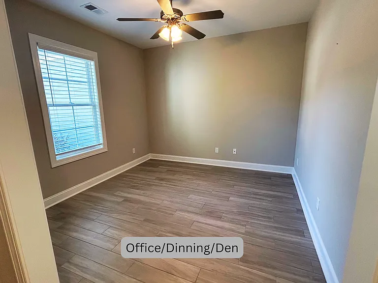 Front room that may be used for an office, dining area, den or other