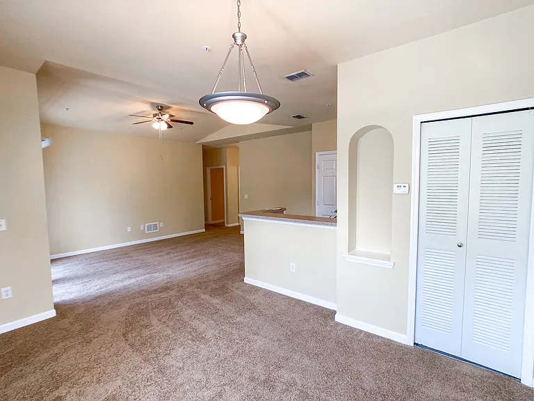Open Concept Design with Lush Carpet in the Living and Dining Rooms Open Concept Design with Lush Carpet in the Living and Dining Rooms