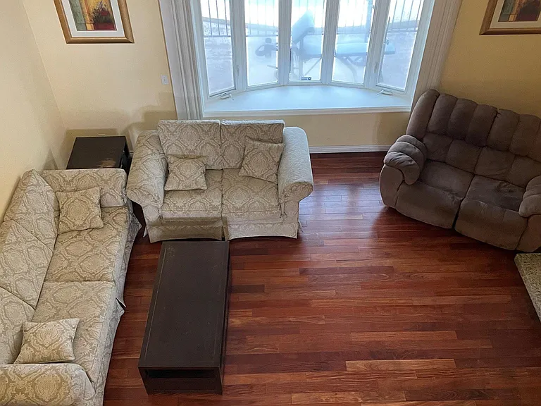 From hallway upstairs to living room with fireplace