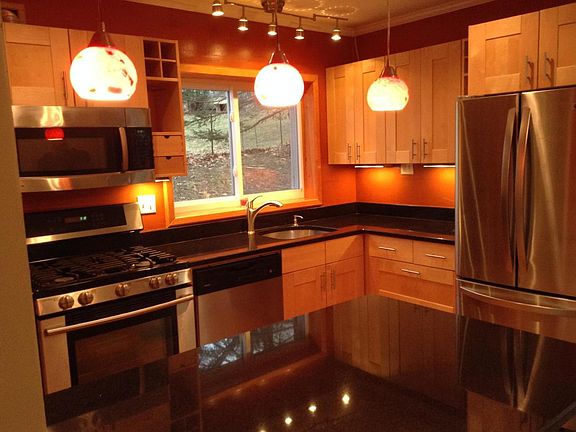 This is the kitchen with granite countertops and stainless steel applicances.