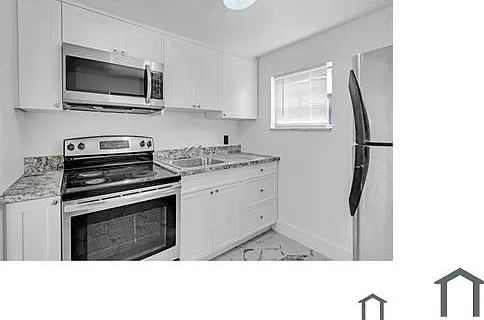 56 NW 62nd St — Photo 1