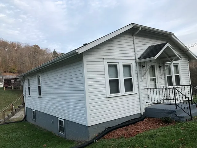 Front and side view of house.