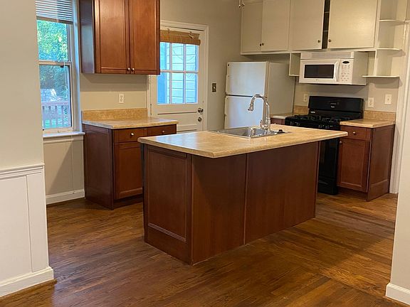 Looking at the kitchen from the living room, very spacious and plenty of storage, also washer and dryer are located here on the right wall in a closet space.