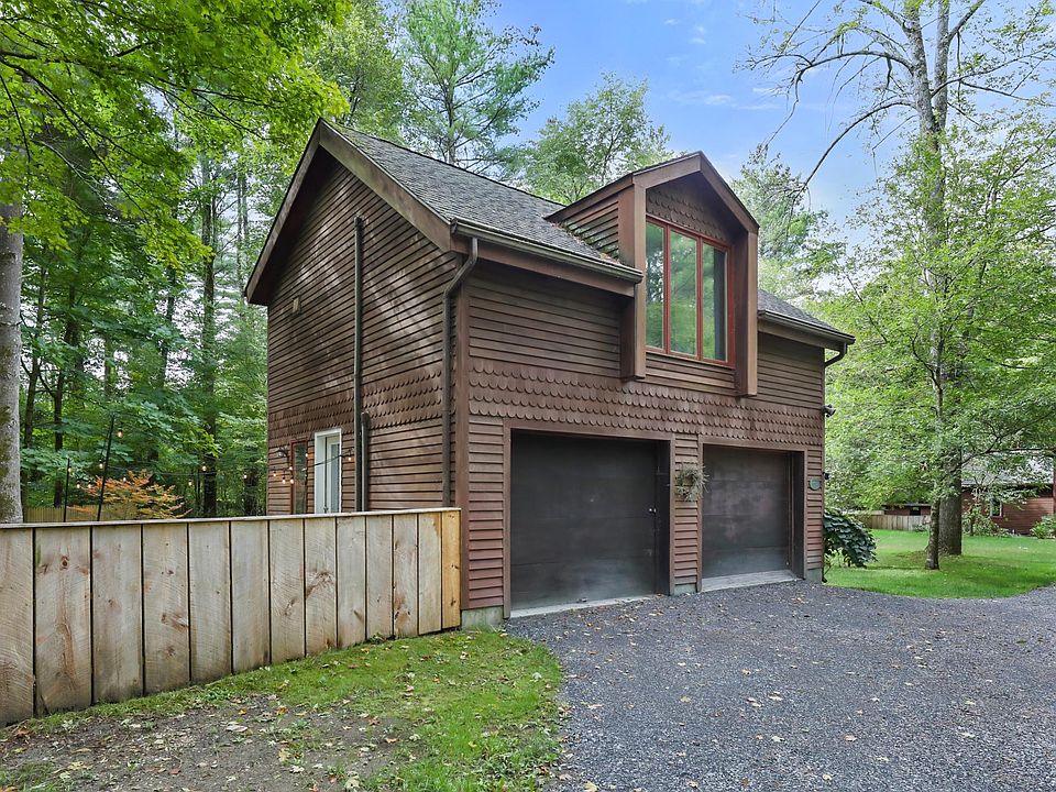 Private driveway, shared with main house, but room for up to 4 cars. Garage stall may be used for ski or bike storage.
