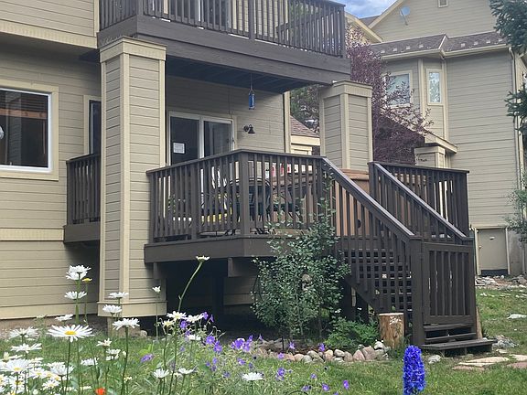 Back yard view of main and second floor decks