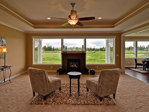 The living area was designed to "frame" and capture the lovely view and setting. Notice the coffered