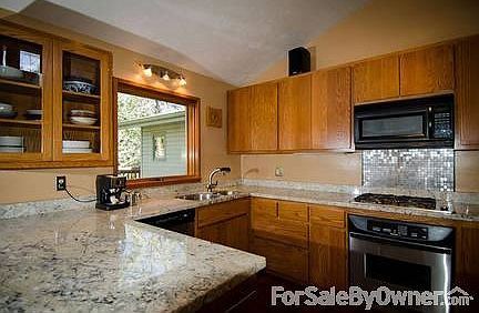 Kitchen
						:
						Watch the birds in the garden as you do dishes!