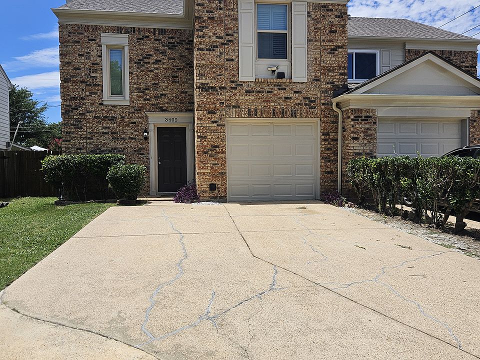 Front of house with 4 car parking.