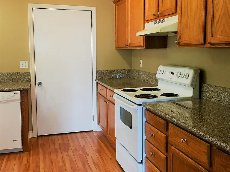 Kitchen with granite countertops and pergo flooring