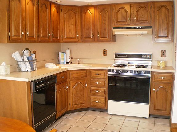 Kitchen features ceramic tile flooring