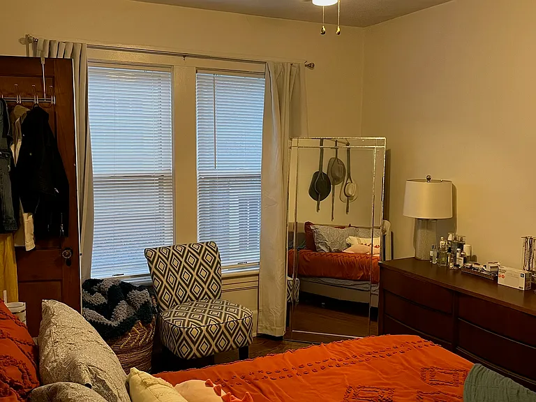 Bedroom One w/ Designer Ceiling Fan and Two Large Windows.