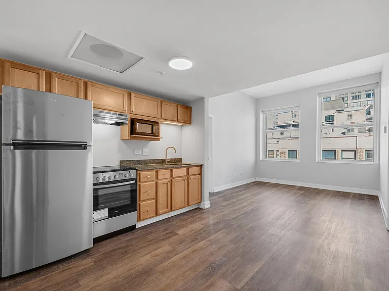 Open concept kitchen/dining/living area in all apartments.