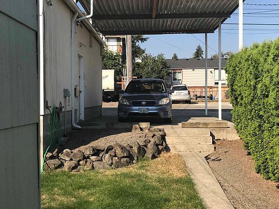 Carport has room for one car, but may also be used as an outdoor area to your cottage.