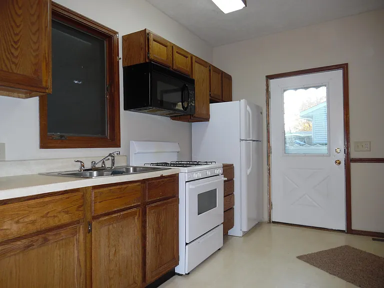 Door leads to deck between house and garage.
