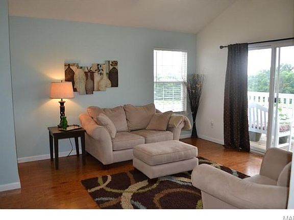 The Great Room is filled with natural light from the beautiful hardwoods to the vaulted ceiling.