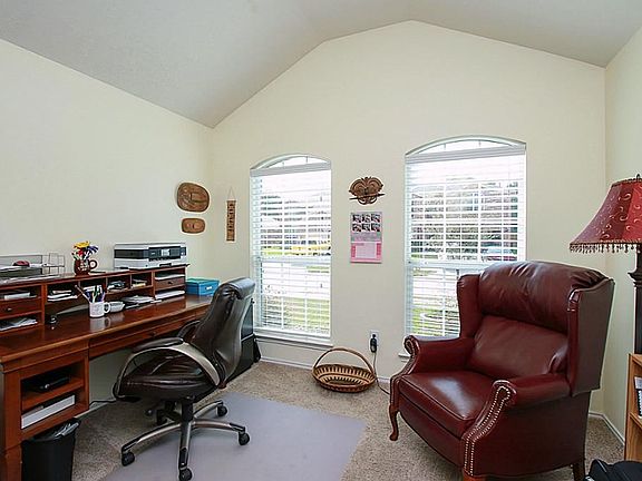 Yes this lovely home comes with your very own private study with french doors.   Plenty of space for a desk or two, book shelves, and/or a couple reading chairs.  Notice the high ceilings and bright sunny windows.