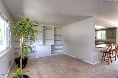 Living Room with Built-ins and large picture window.