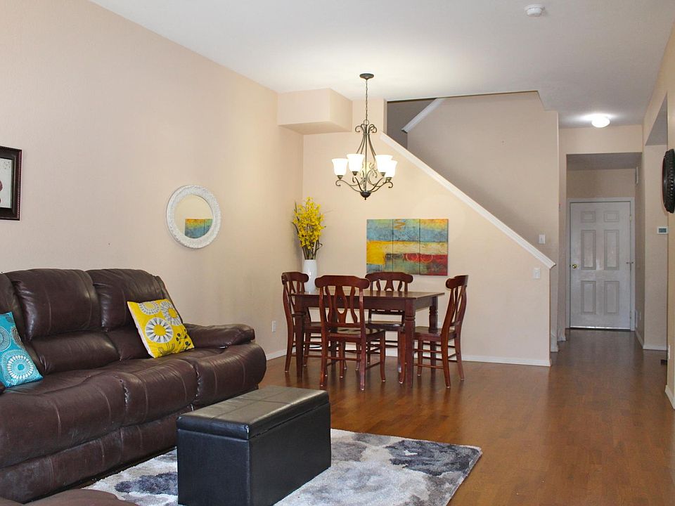 Spacious living room that is open to the dining room measures 24 ft by 12 and half ft.