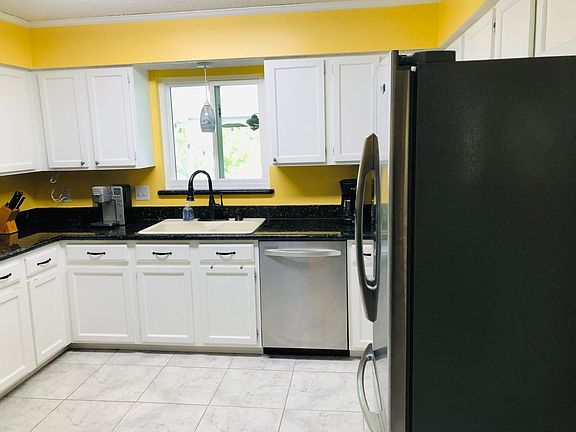 Kitchen with all the necessities. Stainless steel appliances and large pantry. Includes a kitchen table and four chairs.