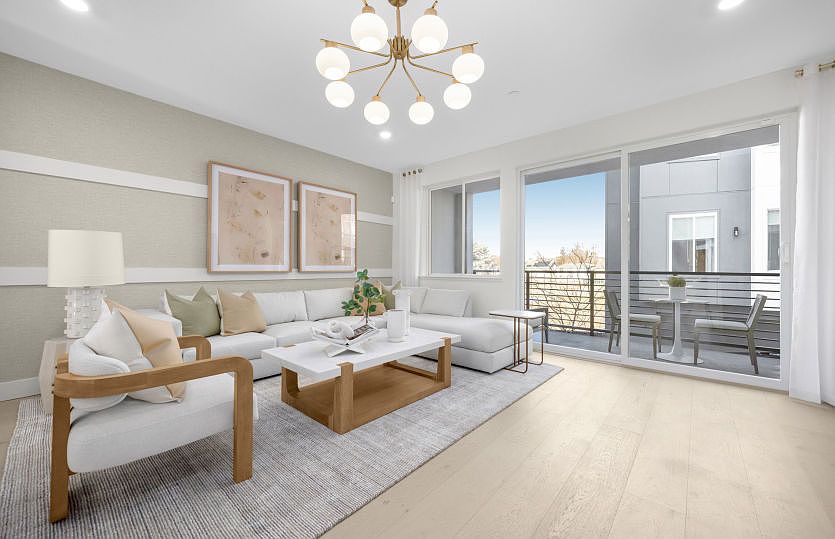 Gathering room with sliding glass door and balcony access