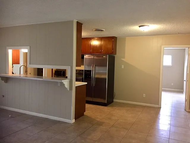 Kitchen w/breakfast nook, entry to main bedroom.