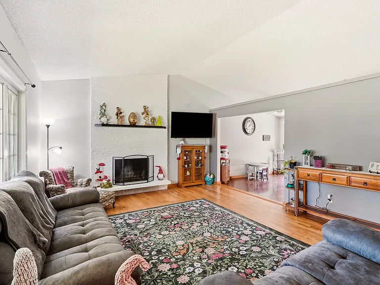 living room has high ceilings with large main window