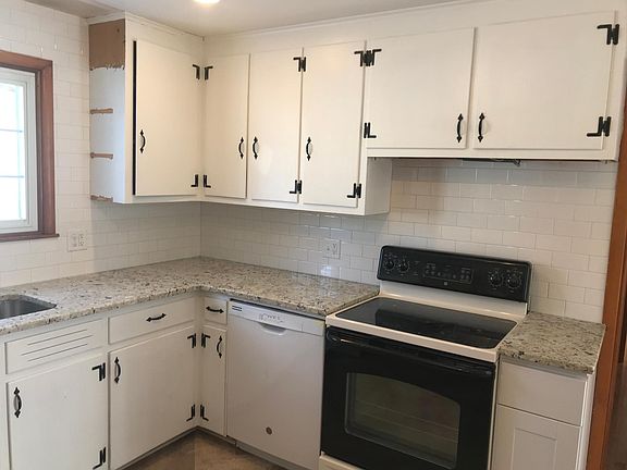 Kitchen with beautiful granite and tile back splash (currently finishing up the final touches)
