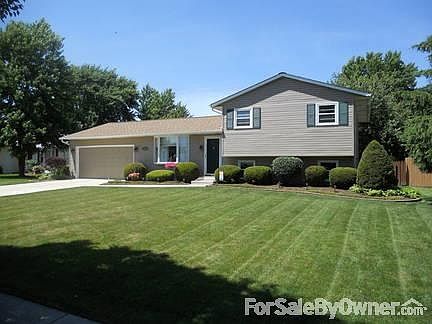 Landscaped beds and manicured lawn