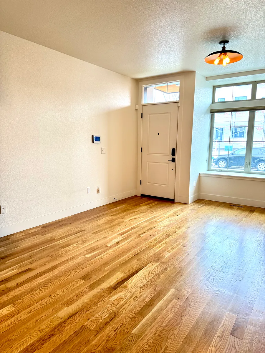 Living room on main level, real hardwood floors (not vinyl). - 4178 W 13th Ave