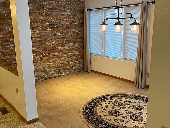 Dinning Room with accent rock wall.