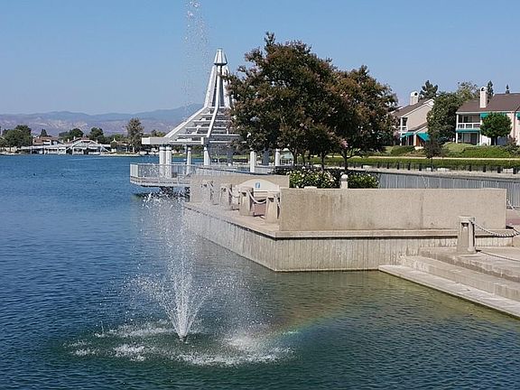 Woodbridge lake with boating, volleyball, basketball and beach areas.